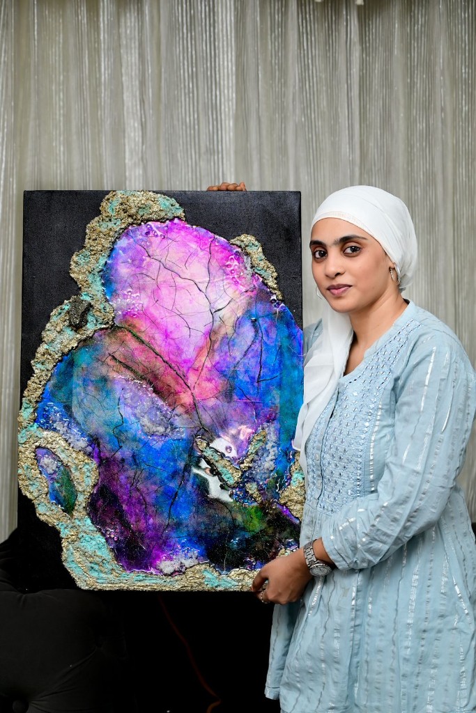Salma Nawaz with a handcrafted geode resin art piece